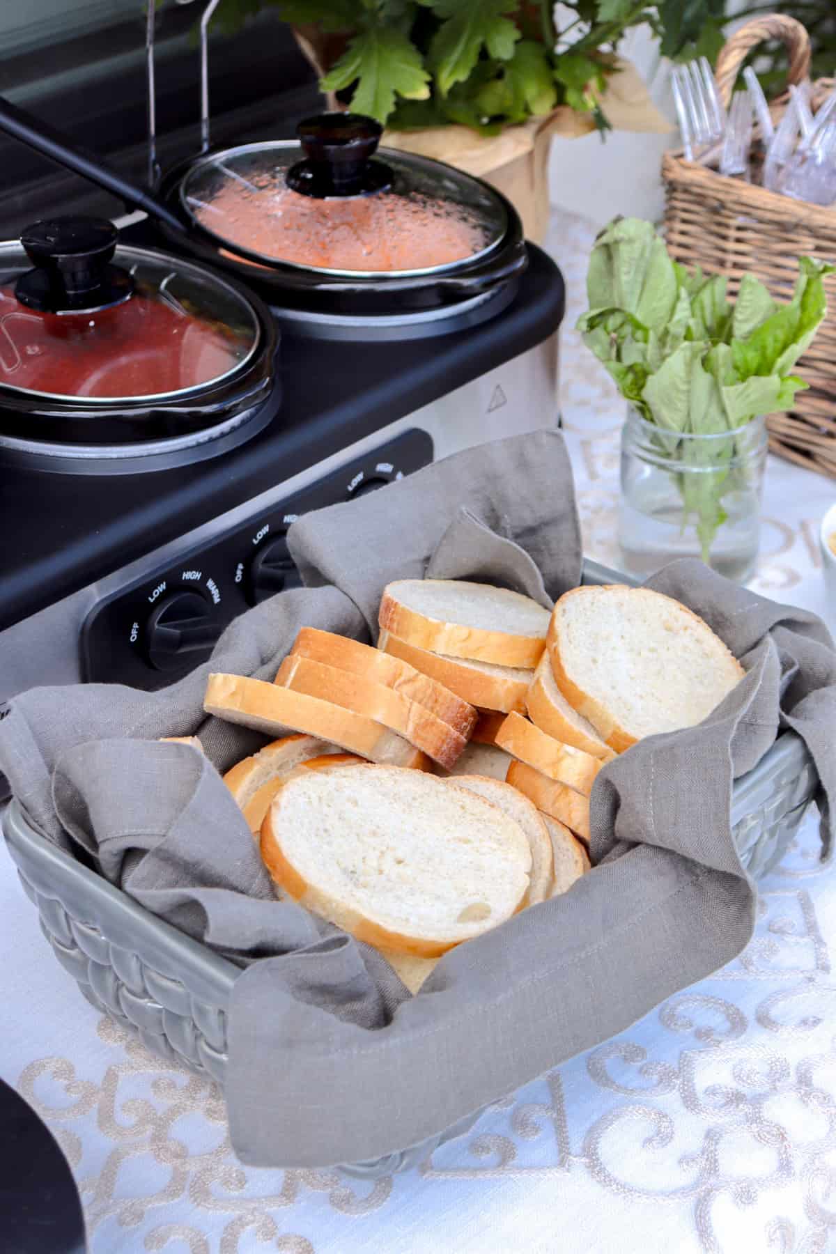 Bread and pasta sauces on table.