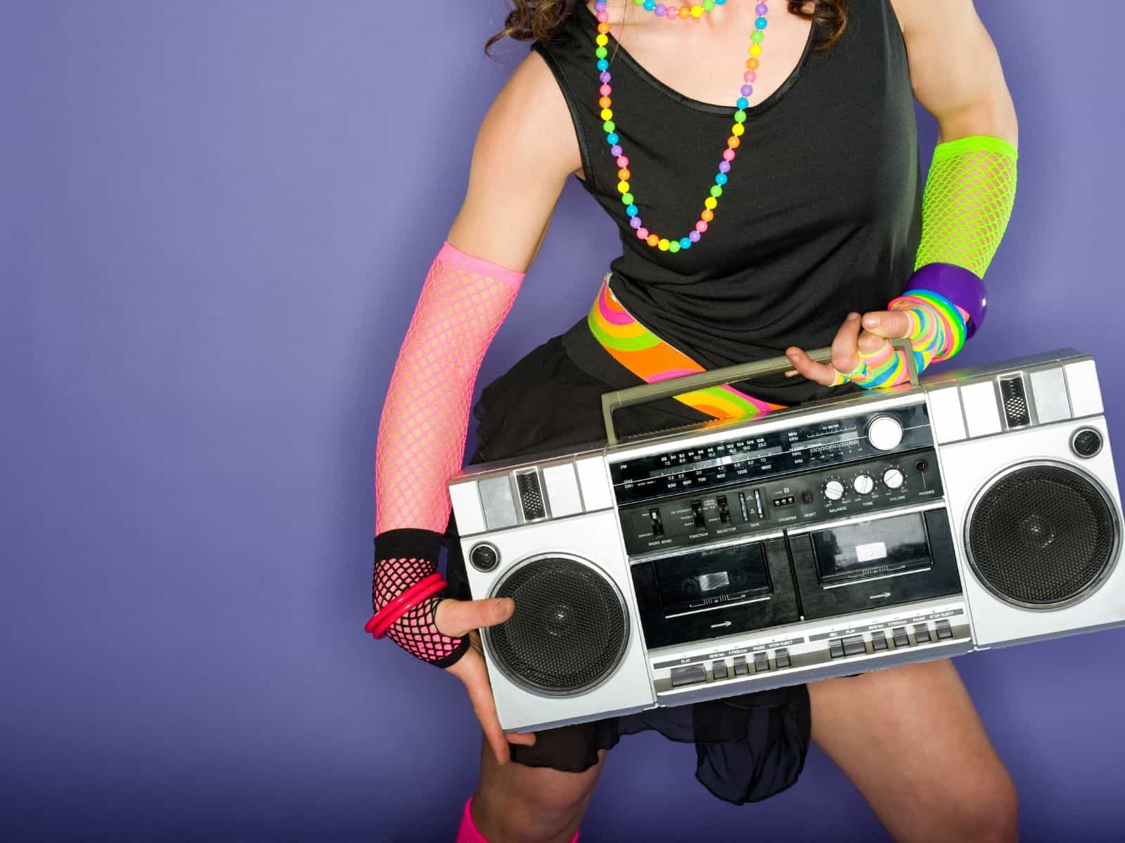 Woman dressed in 80's apparel for party.