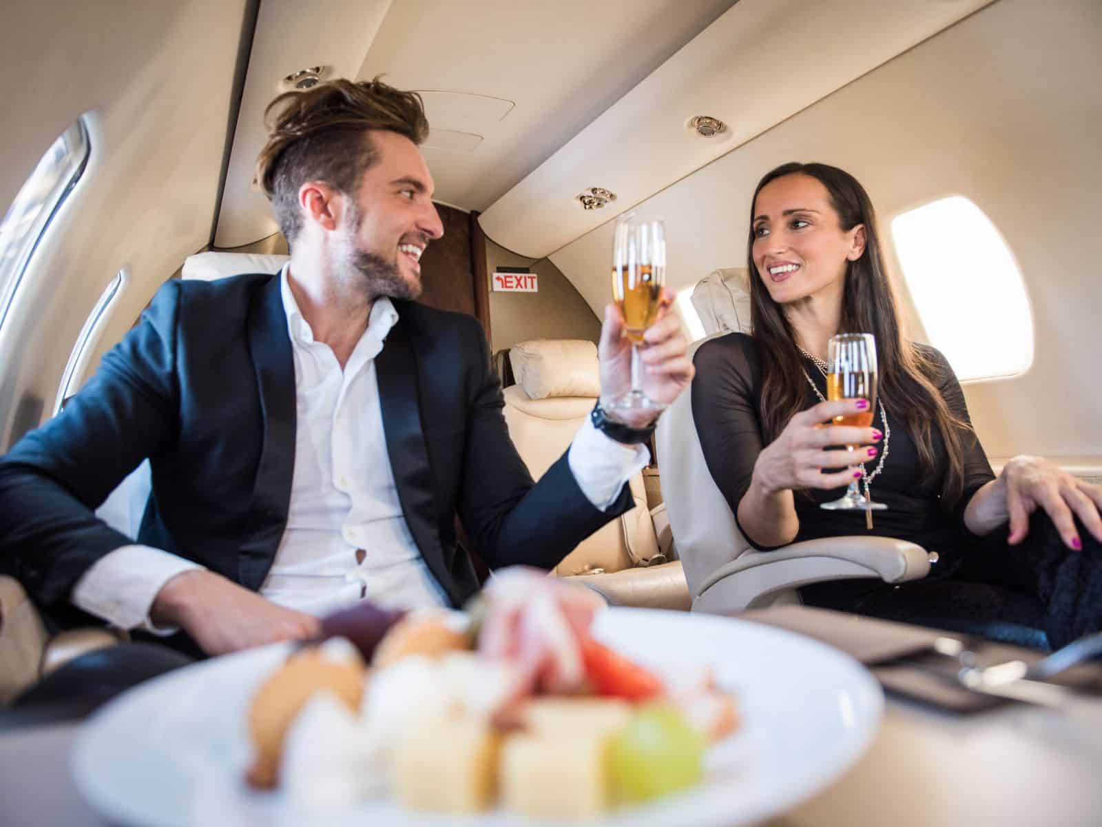 Couple sitting first class on a plane.