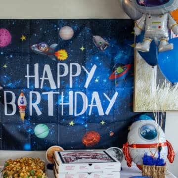 Space happy birthday sign at party.