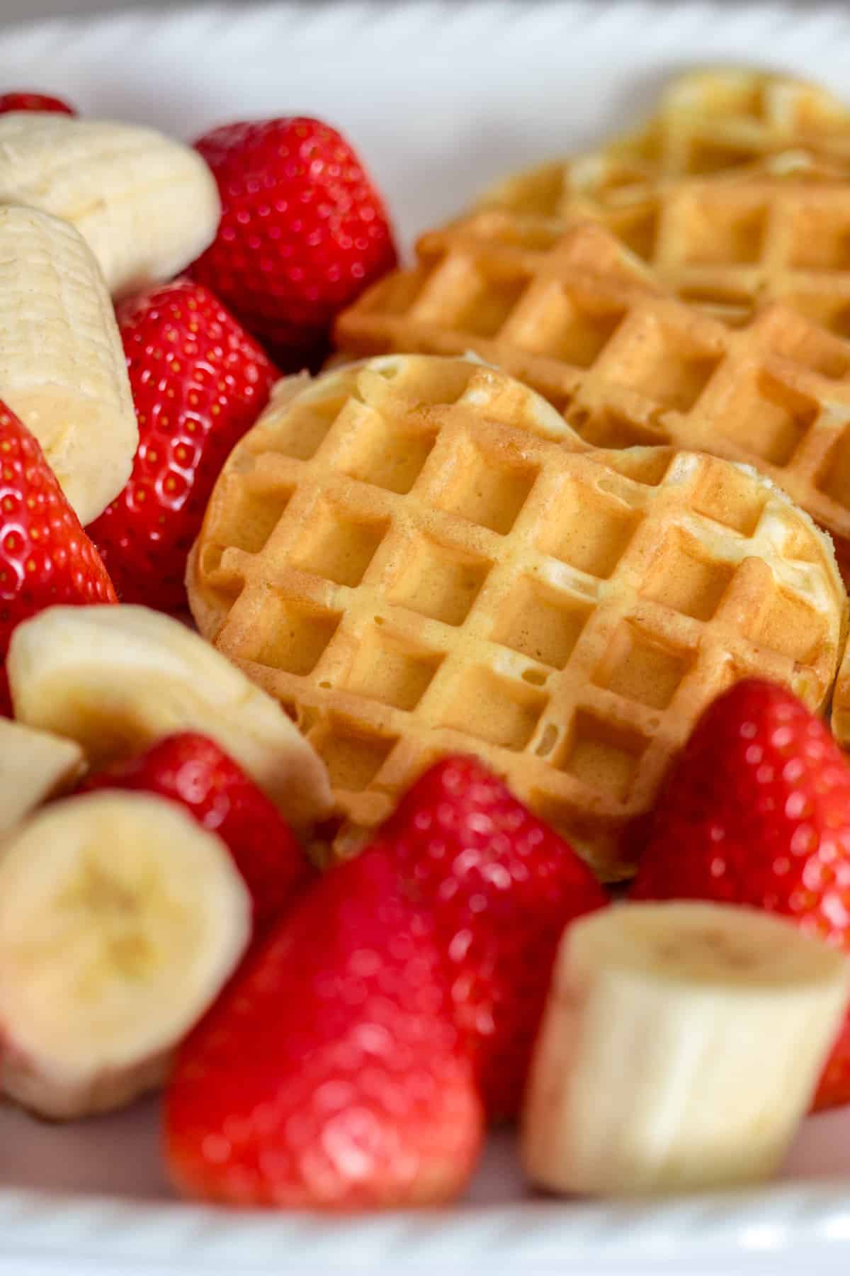 Heart shaped waffles and strawberries.