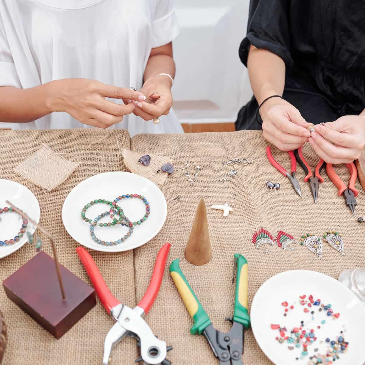 Women making jewelry at home.