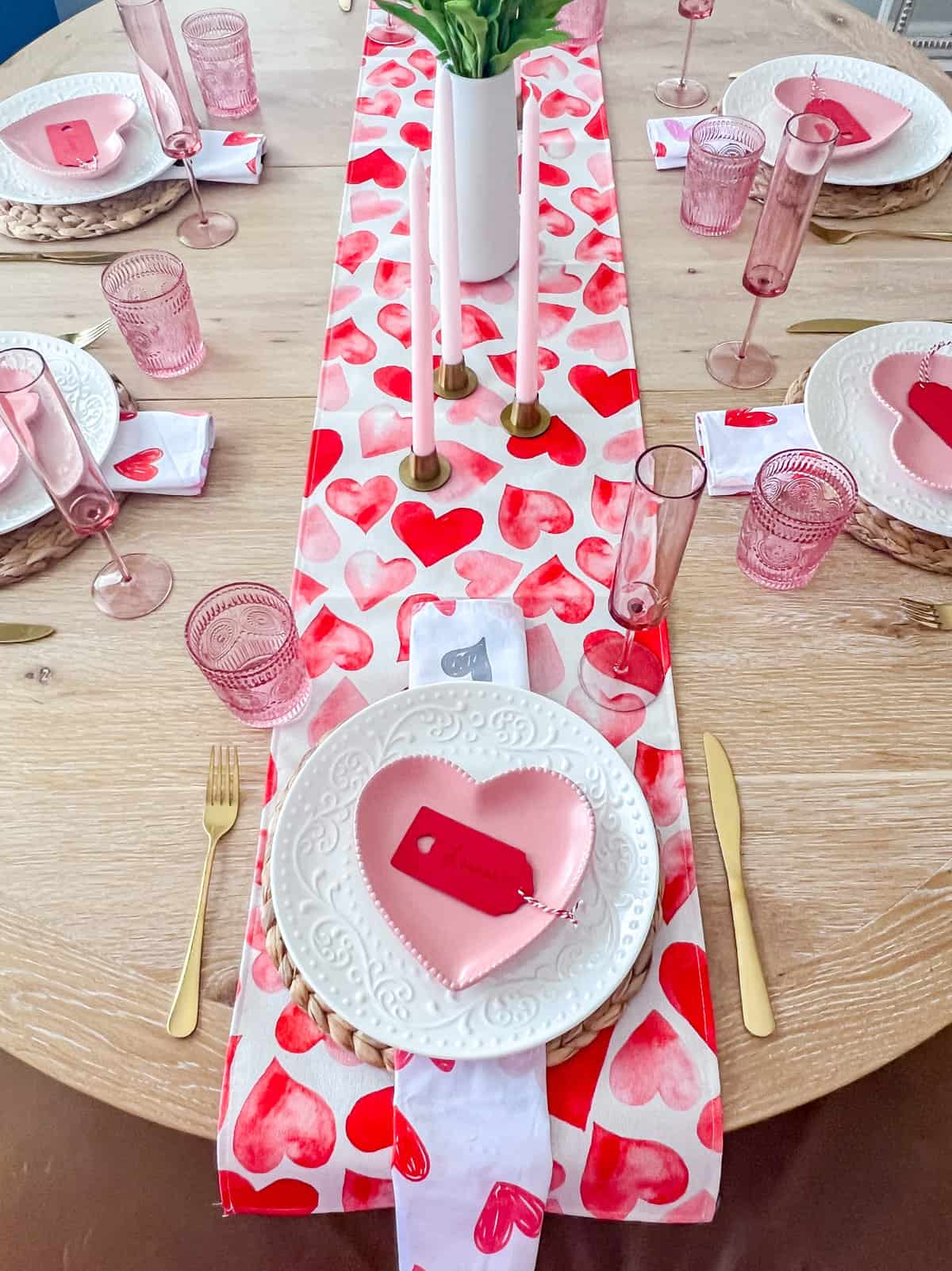 Pink and red tablescape idea with heart table runner.