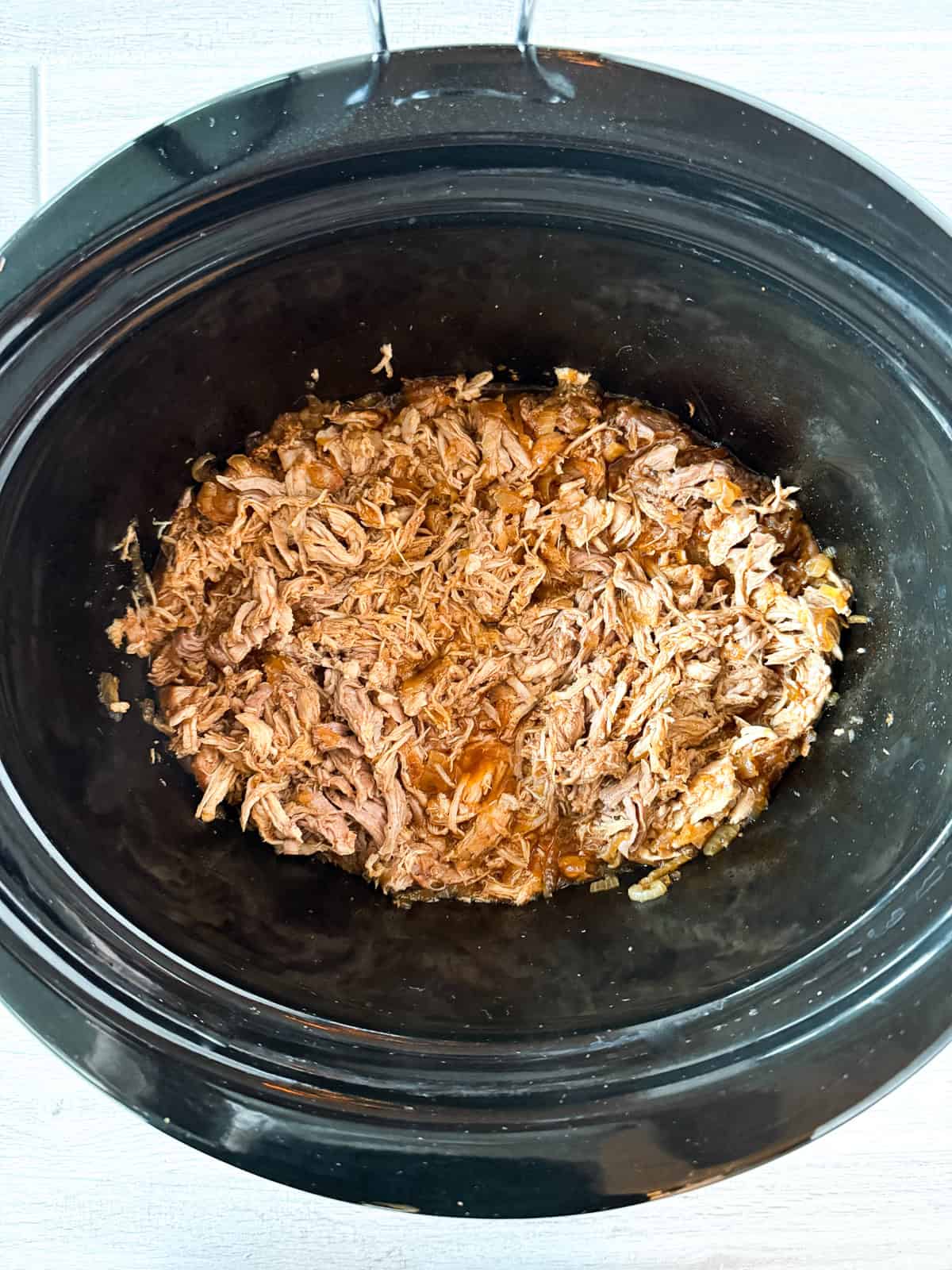 Shredded pork in slow cooker.