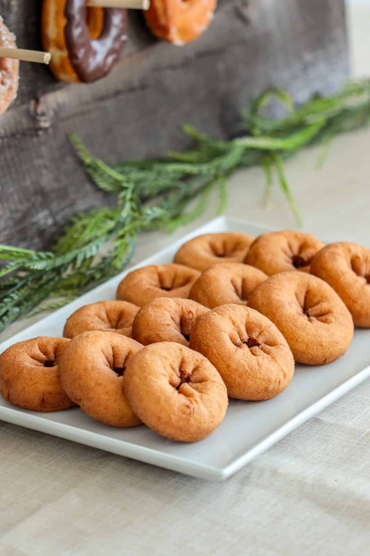 Plain donuts on table.