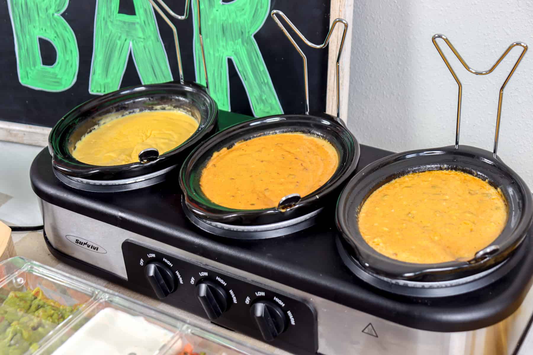 Cheese sauces in mini crock pots.