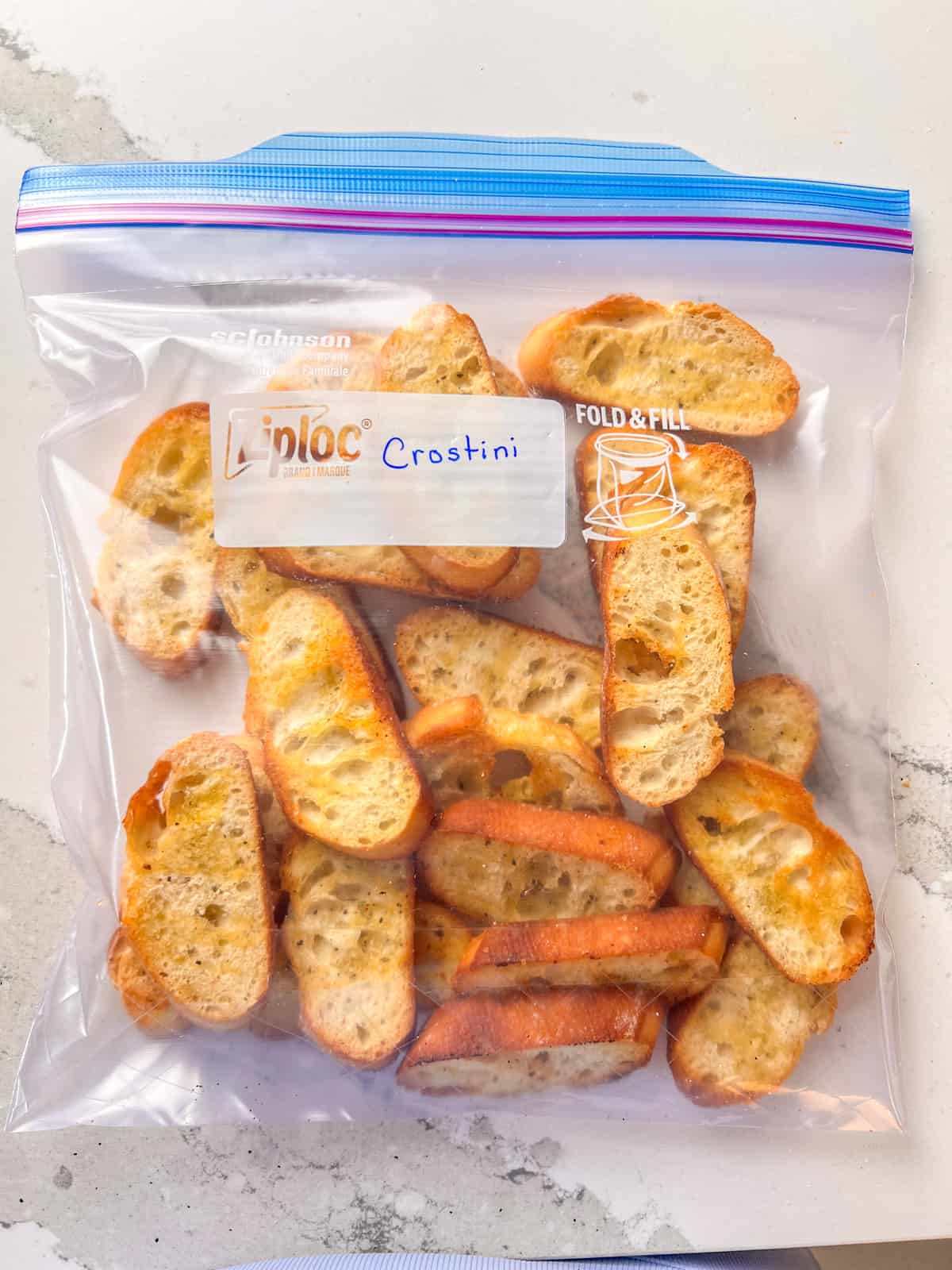 Crostini in a Ziploc bag for freezing.