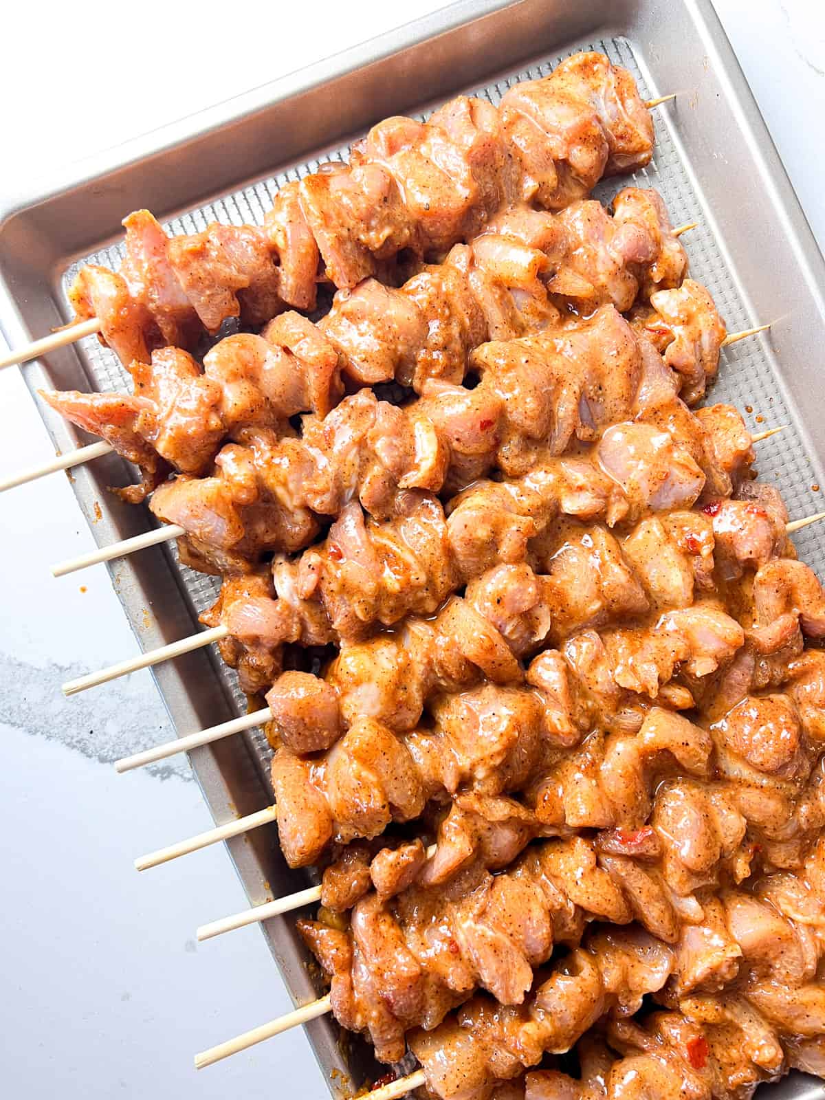 Marinated and skewered chicken thighs.