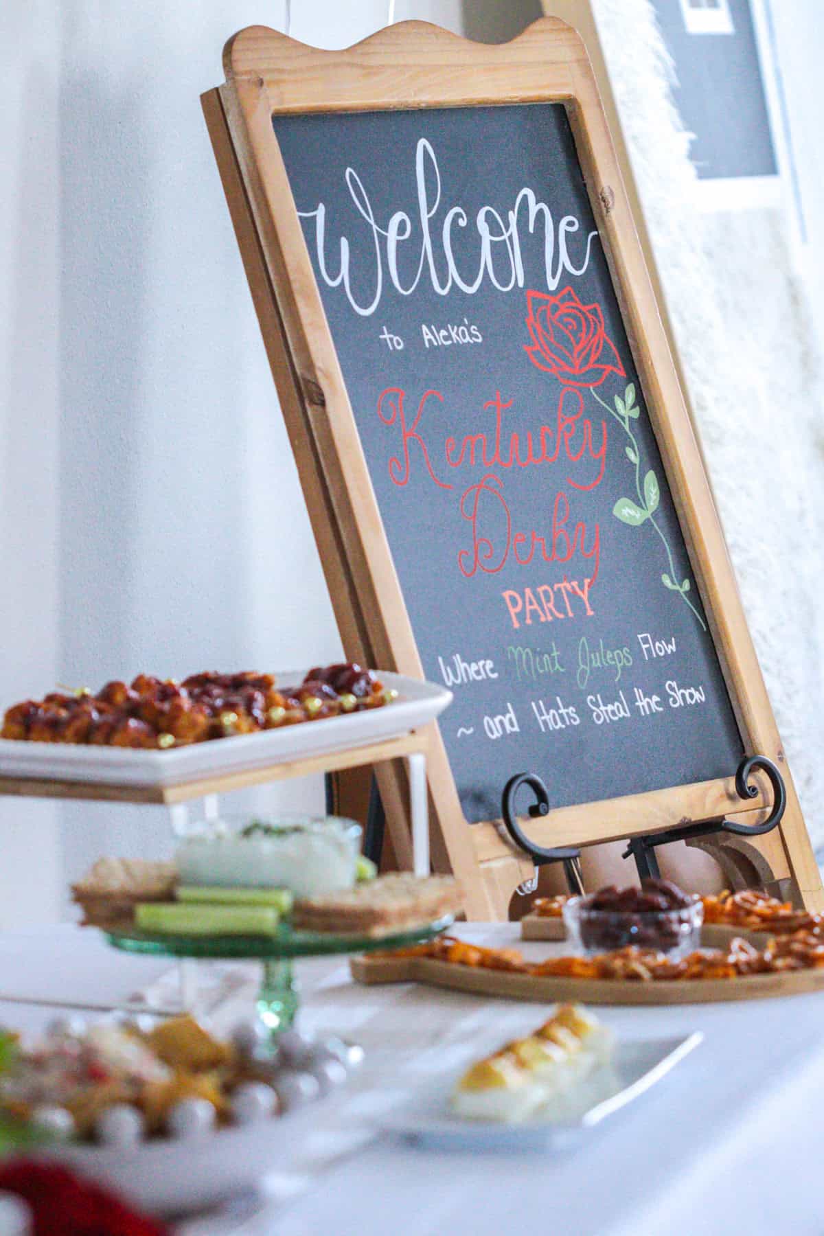 Chalkboard sign at kentucky derby party.