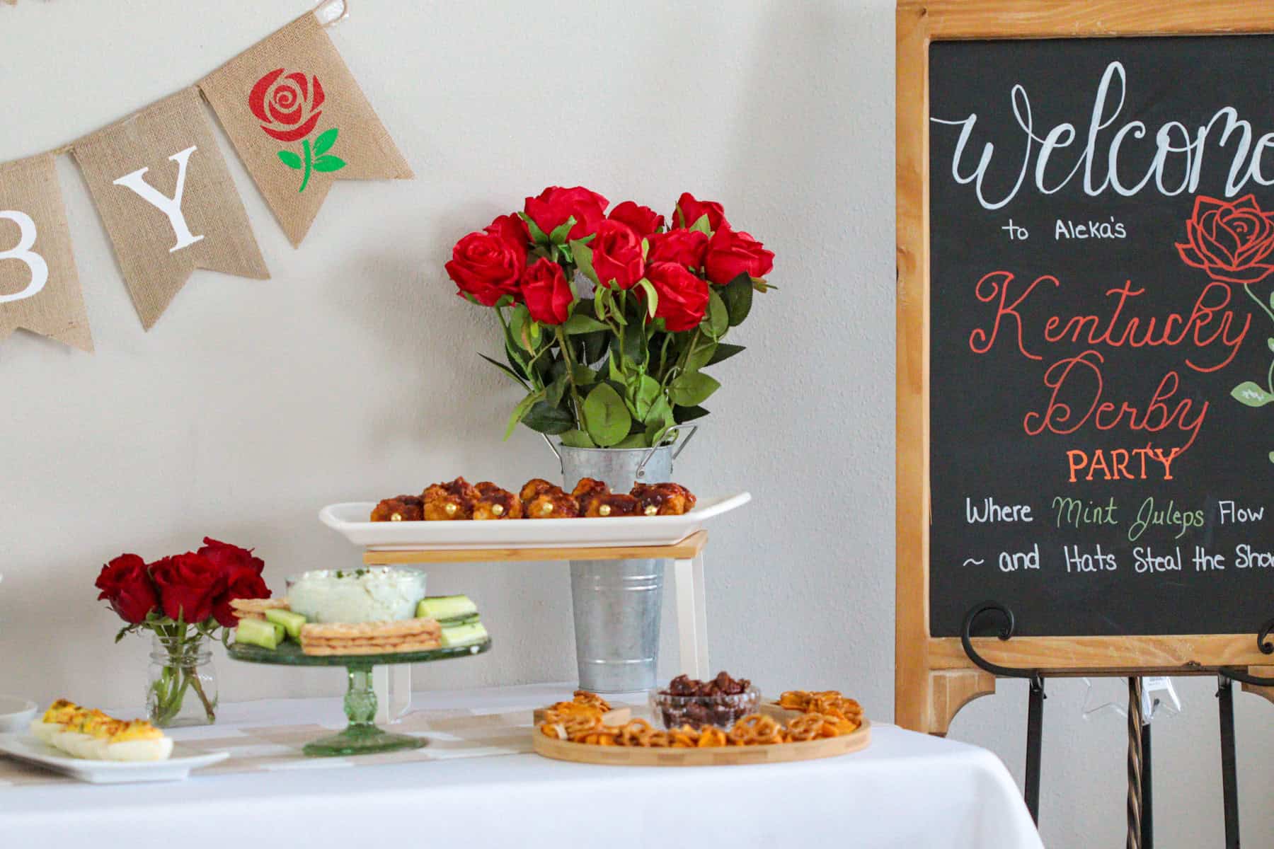 Table with roses and food.