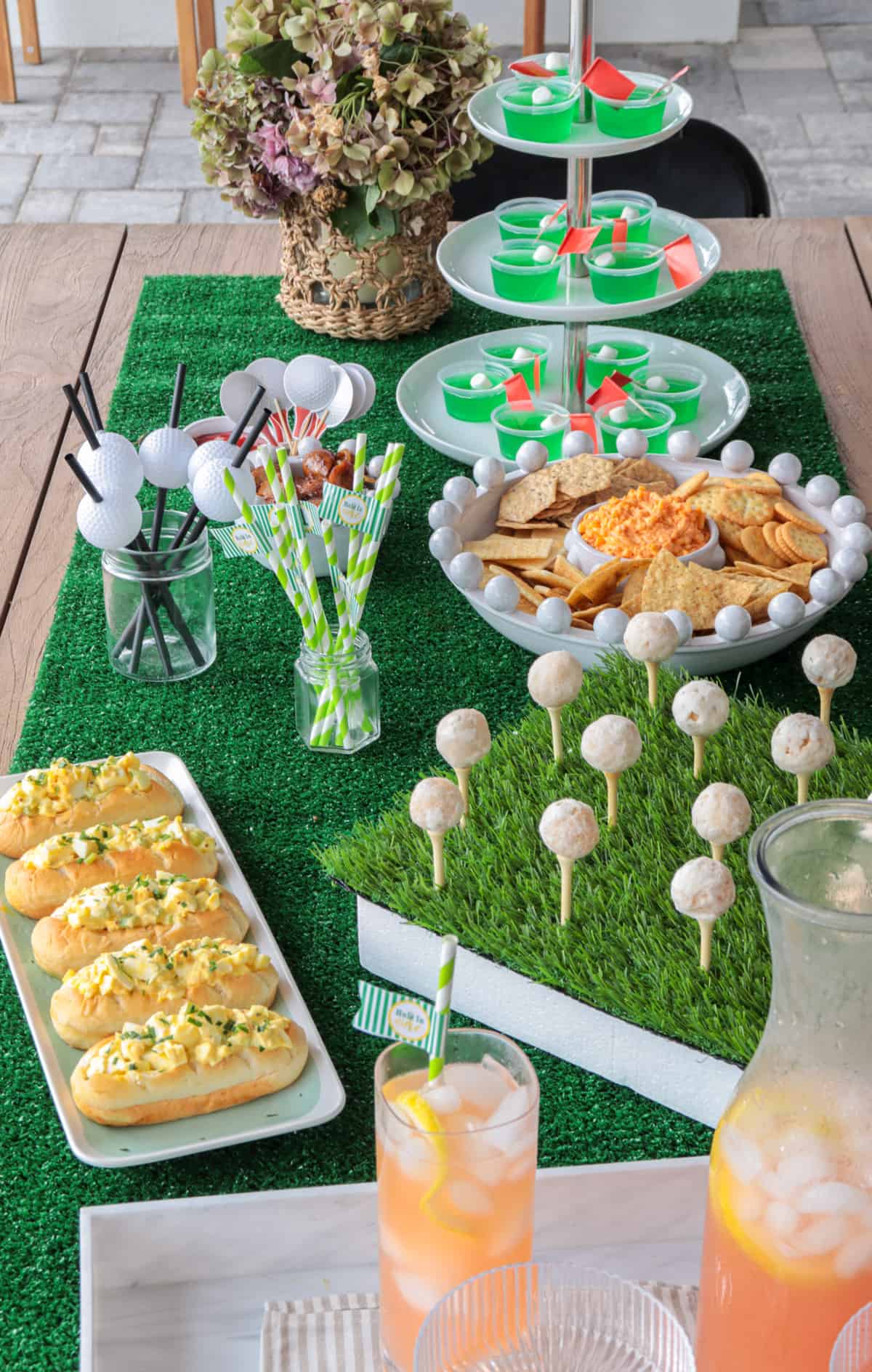 Masters party table with food and drinks.