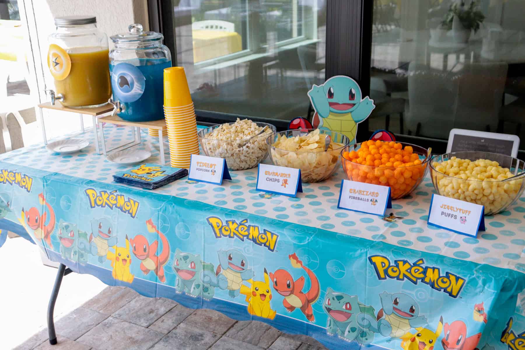 Pokemon party snack table with pokemon food labels.
