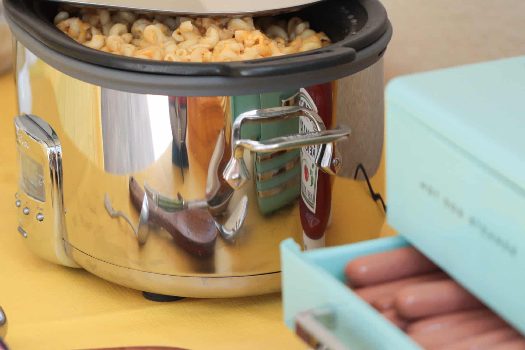 Slow cooker with mac and cheese and hot dog steamer.