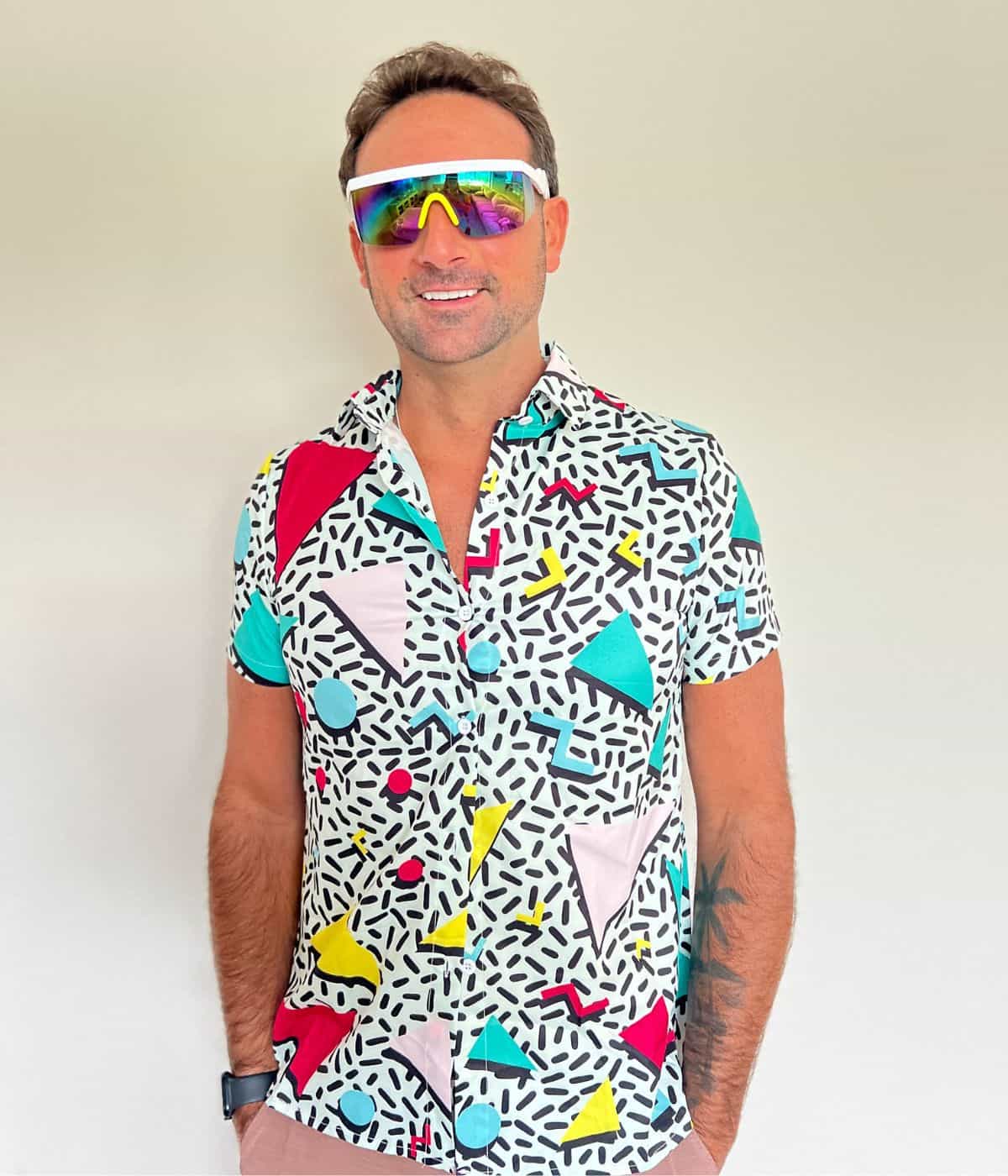 Derek in a retro button down shirt with sunglasses.