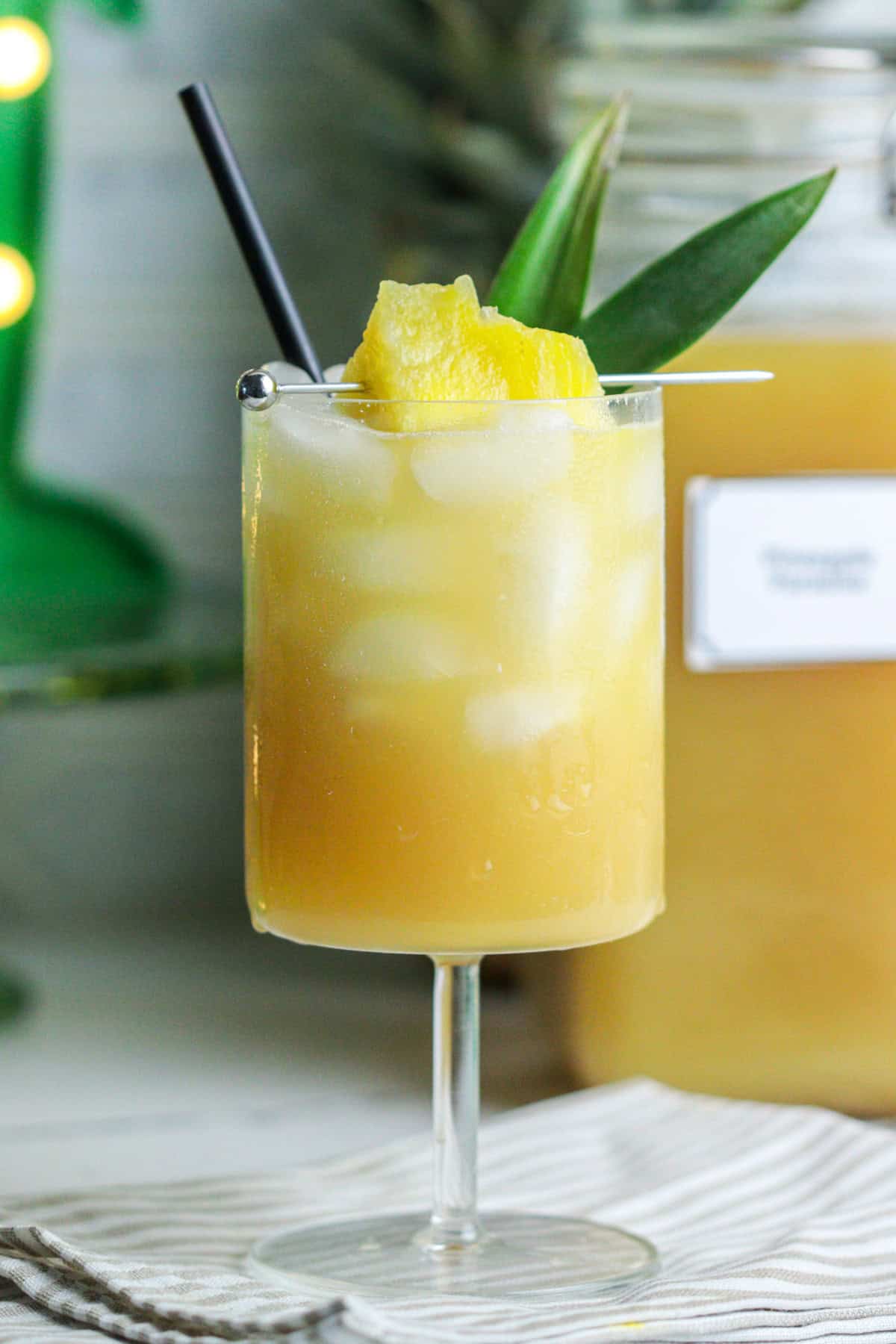 Pineapple coconut cocktail in a glass with garnish.