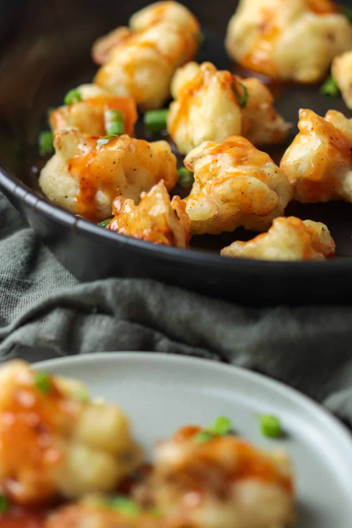 Fried cauliflower on plate for serving.