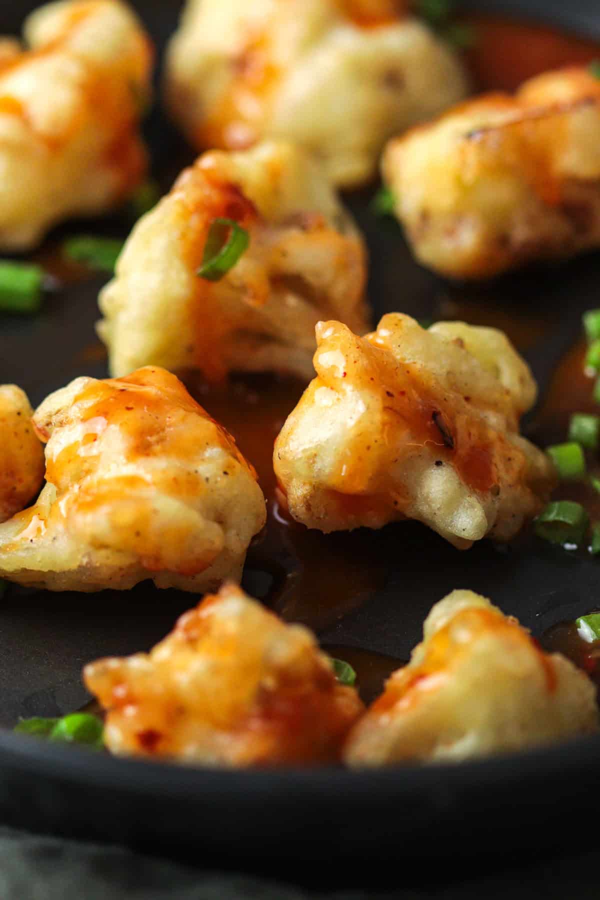 Close up of sweet fried cauliflower on plate.