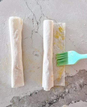 Rolled phyllo sheet brushed with melted butter.