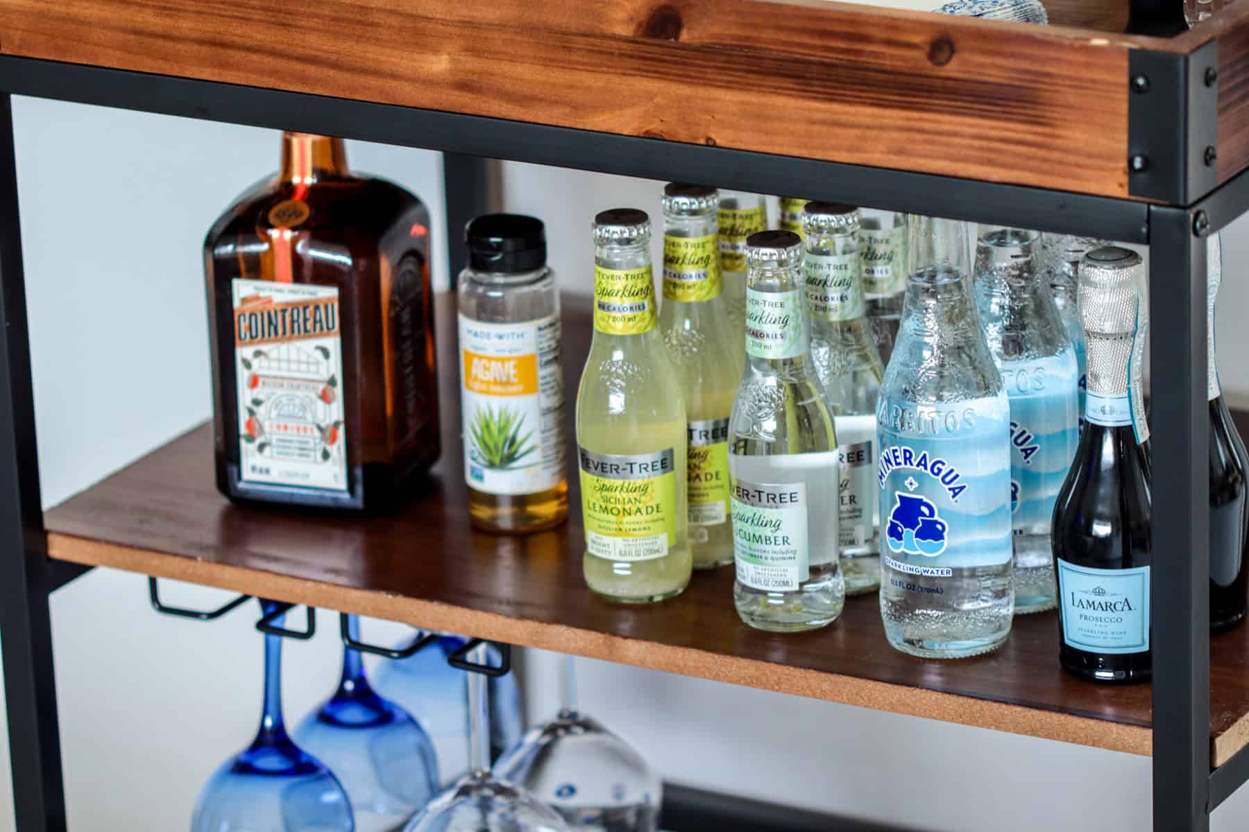 Bar cart with sparkling waters.