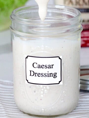 Jar of hoemade ceasar dressing.