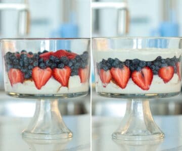 Trifle dish with cake cubes, strawberry, cream and blueberry.