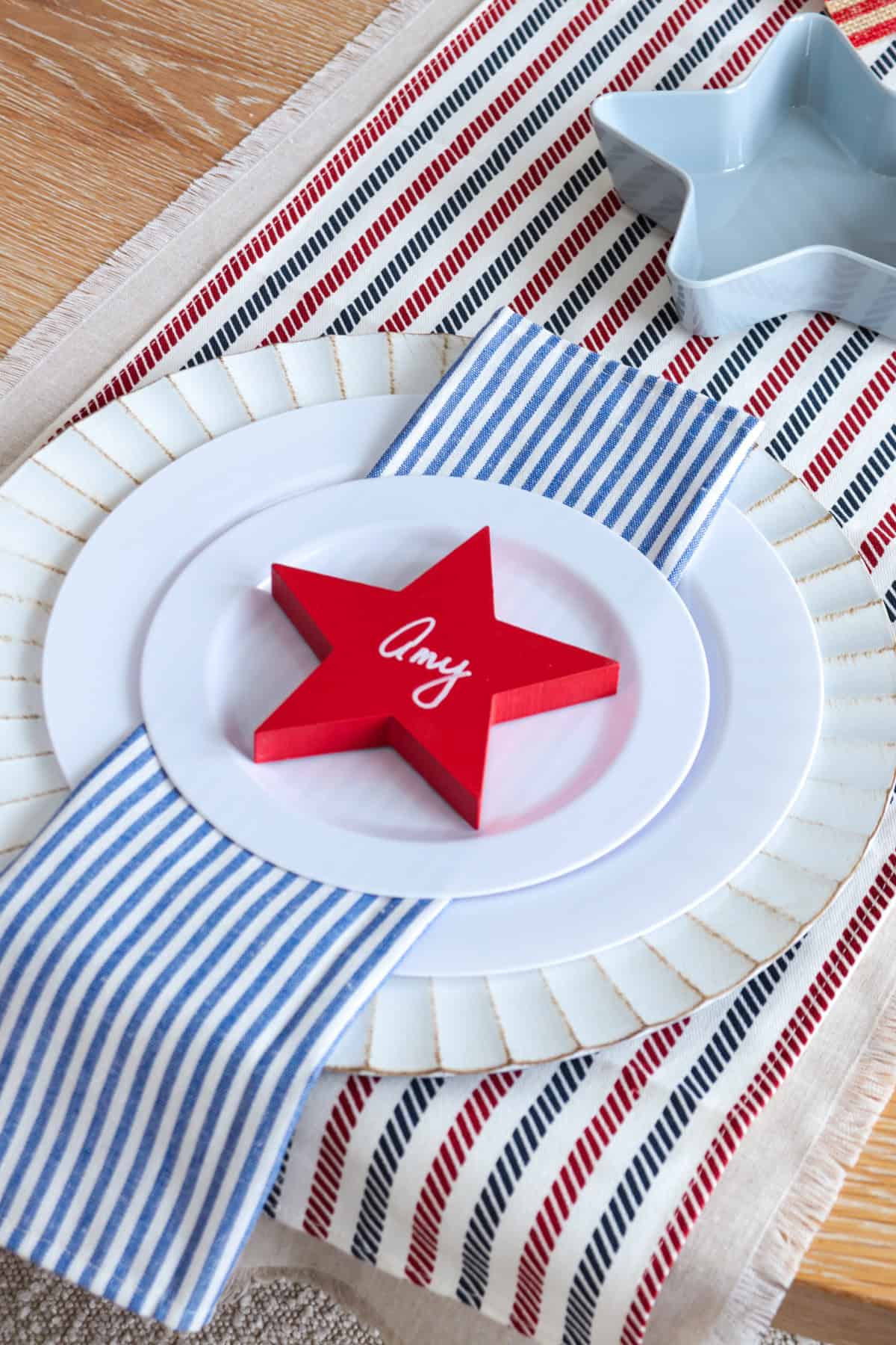 Place setting with red star and name written on it.