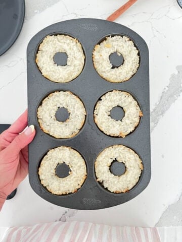 Cooked sushi rice in a donut molder.