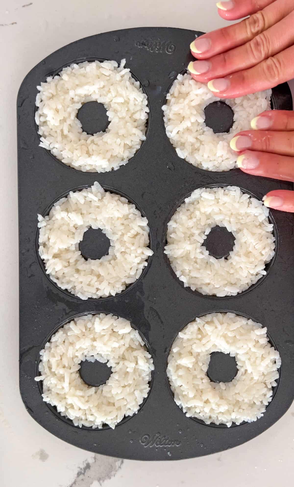 Sushi rice in donut molds.