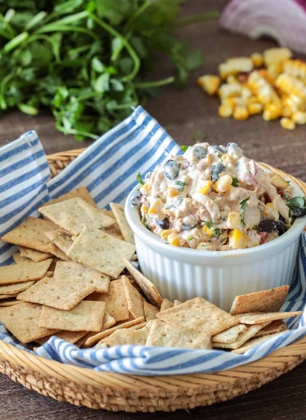 Mexican Chicken Salad in bowl with crackers on the side.