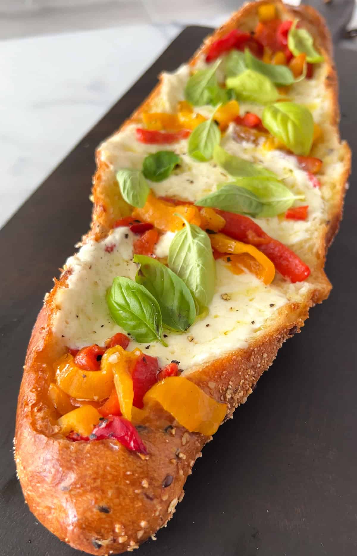 Stuffed french bread with cheese and peppers.