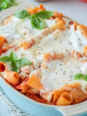 Baked ziti with ricotta cheese in a casserole dish.