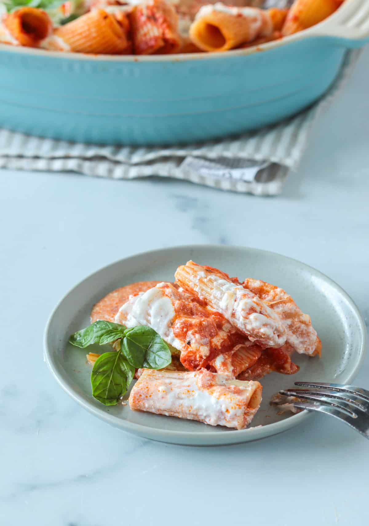 Baked ziti scooped onto a plate.