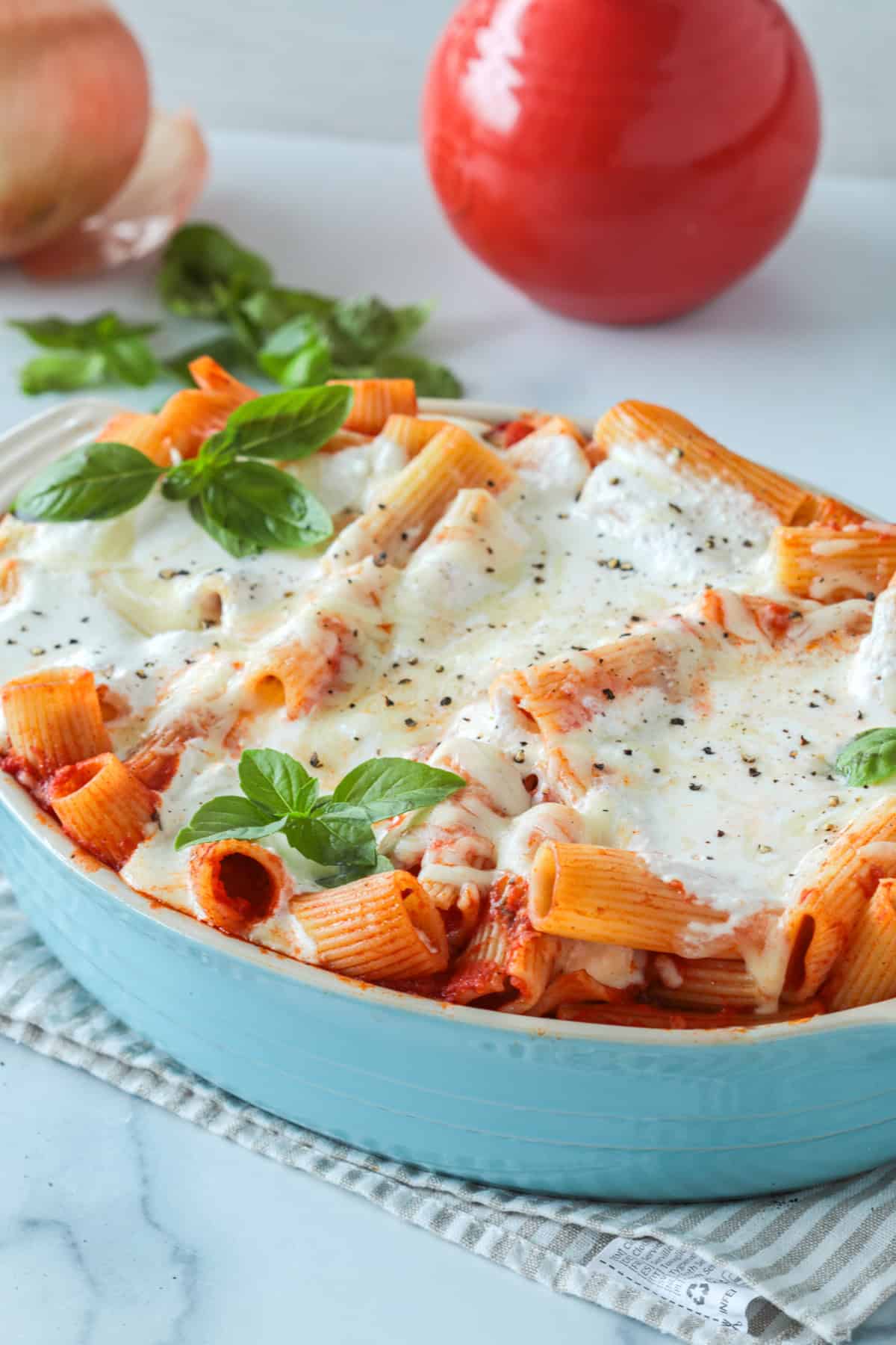 Baked ziti in a casserole dish out of the oven.