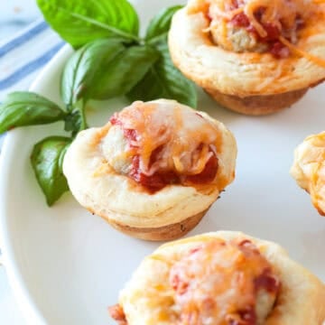 Biscuits stuffed with a mini meatball covered with cheese.