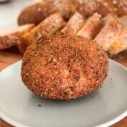 Fried burrata ball on plate.