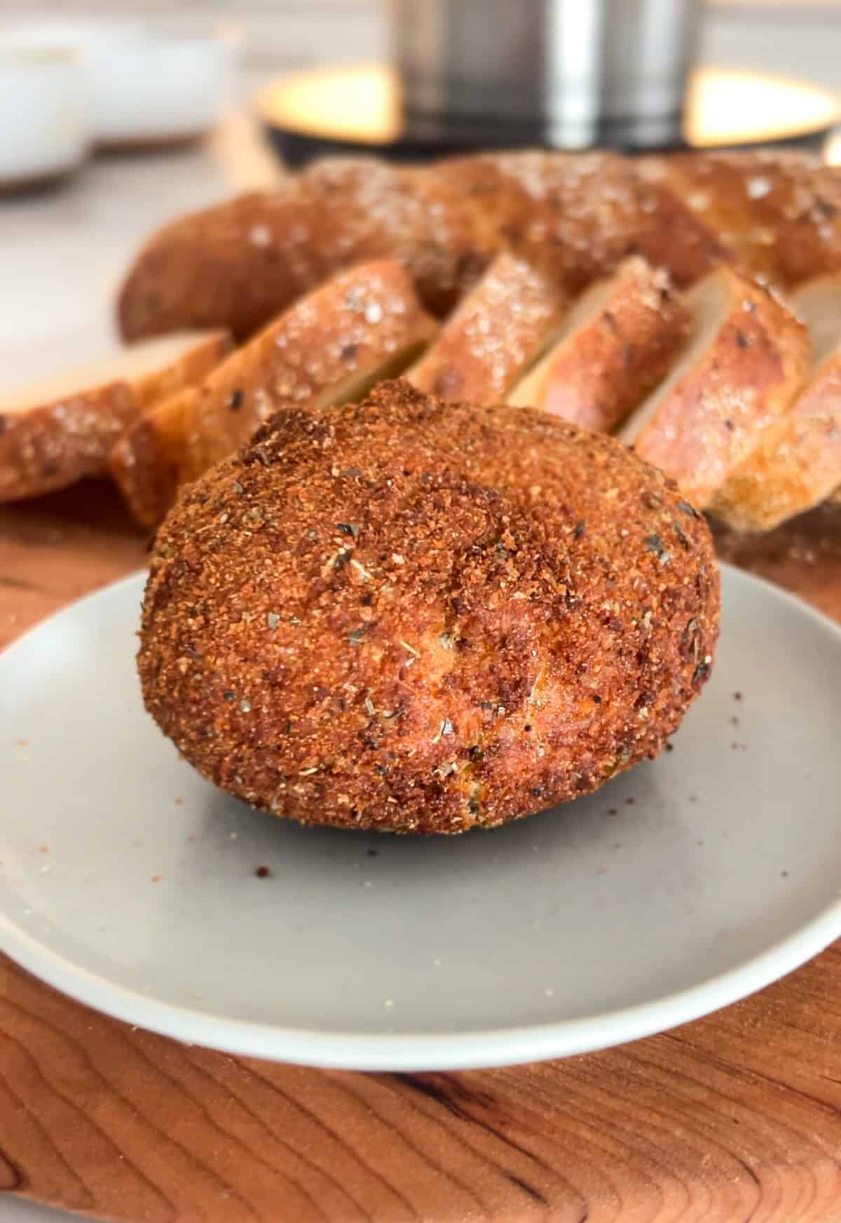 Fried burrata ball on plate.