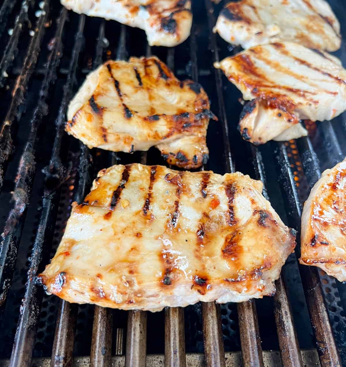 Grilling chicken breasts.