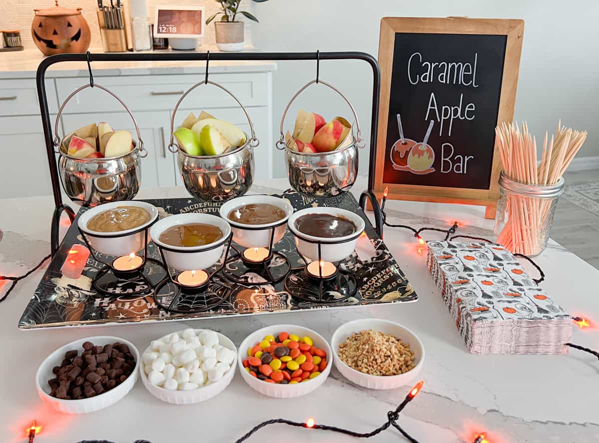 Caramel apple bar on table.