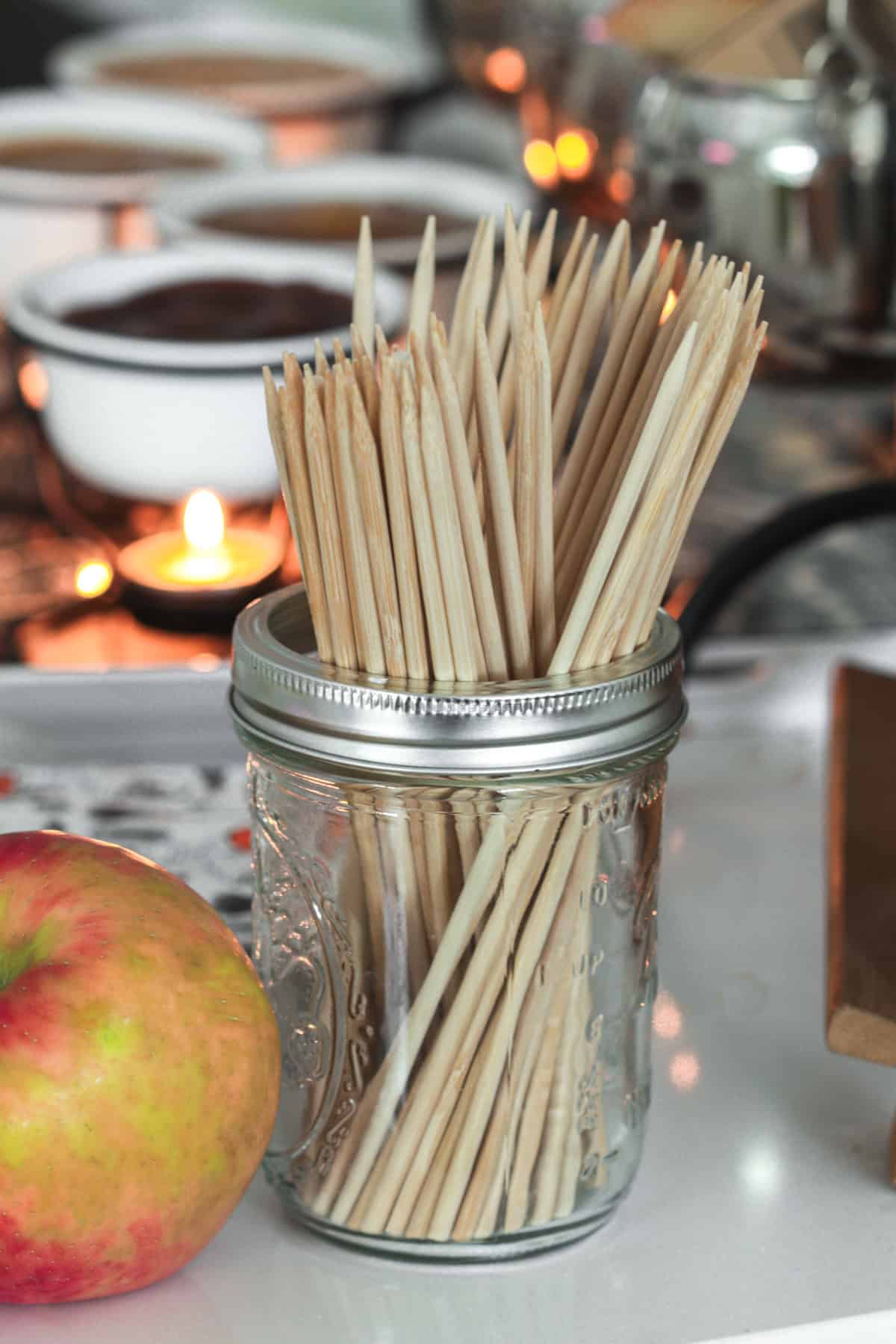 Sticks in a glass for candy apple bar.