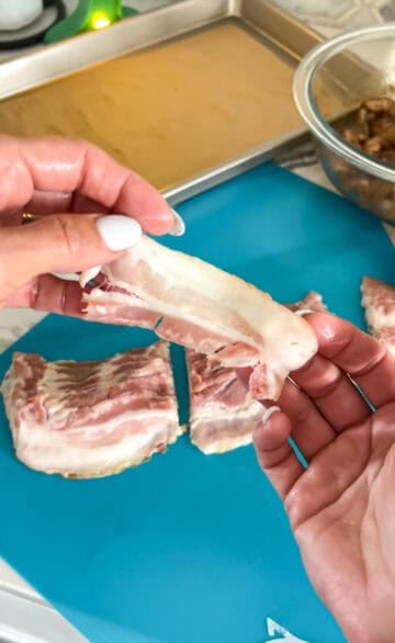 Removing bacon strips.