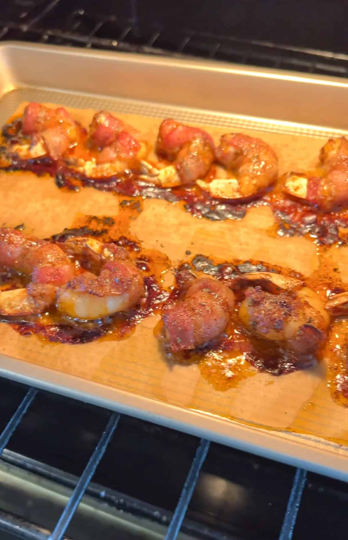 Baking bacon wrapped shrimp in the oven.