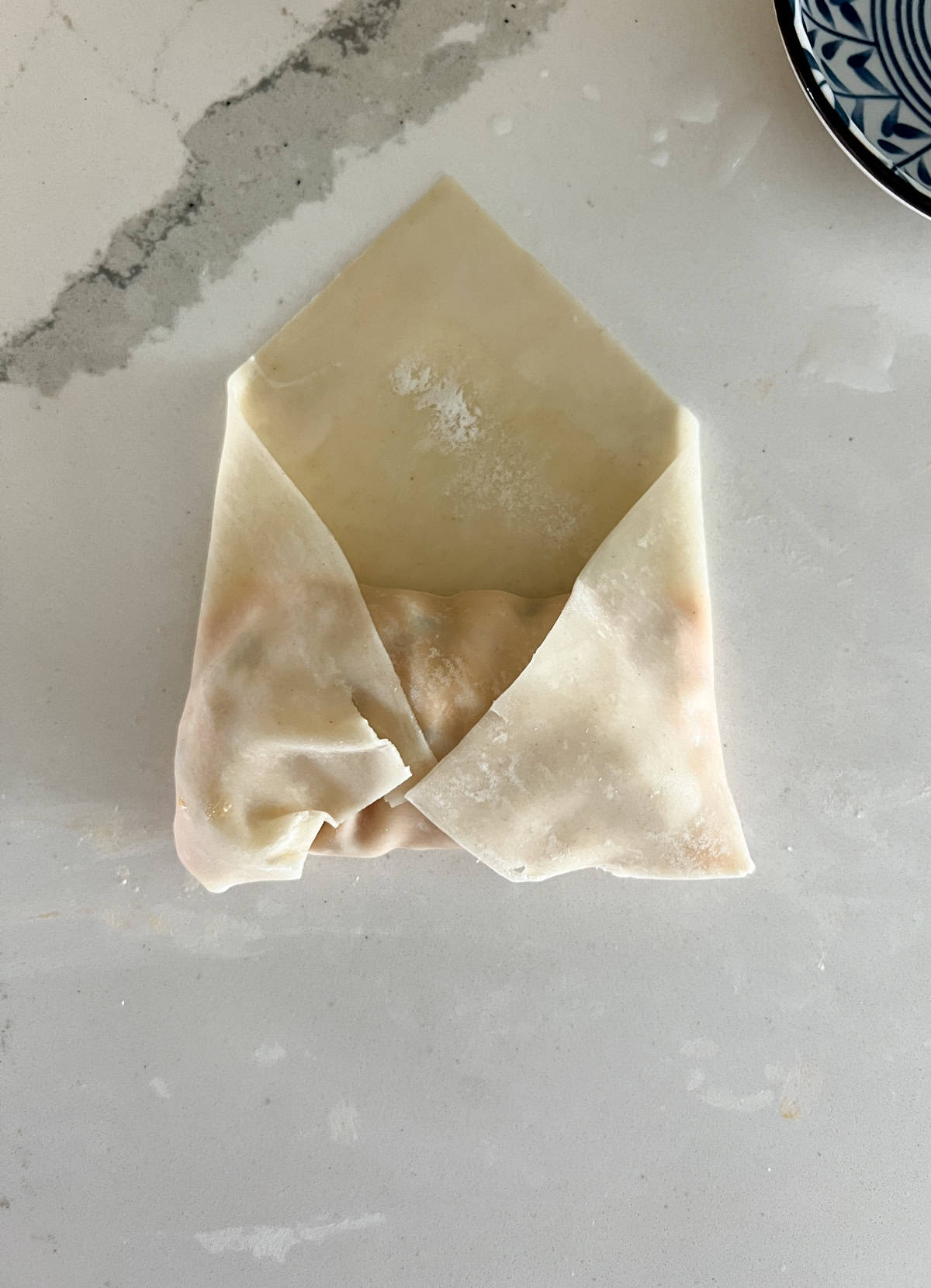 Egg roll folded into an envelope shape.