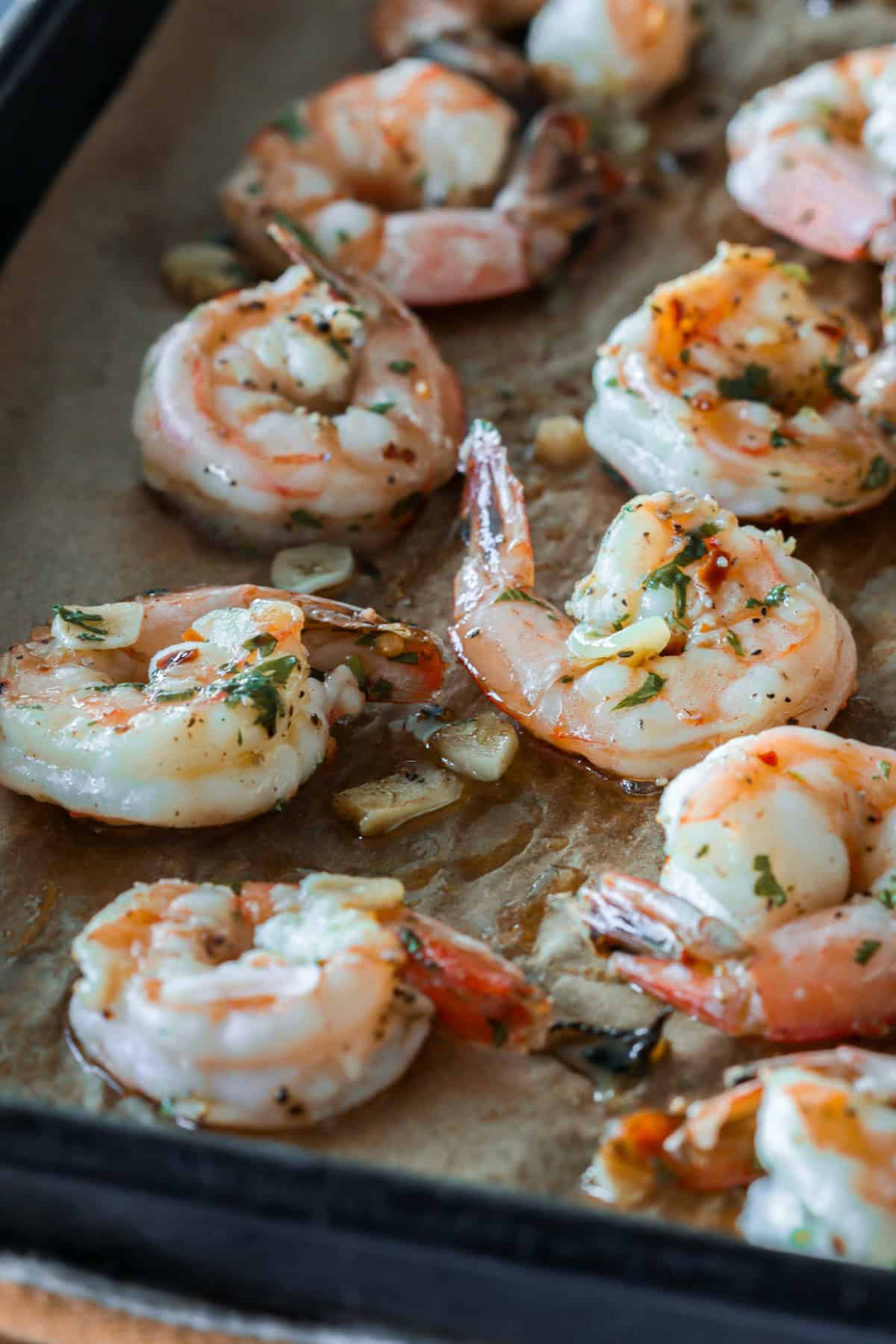 Roasted cocktail shrimp on sheet pan.