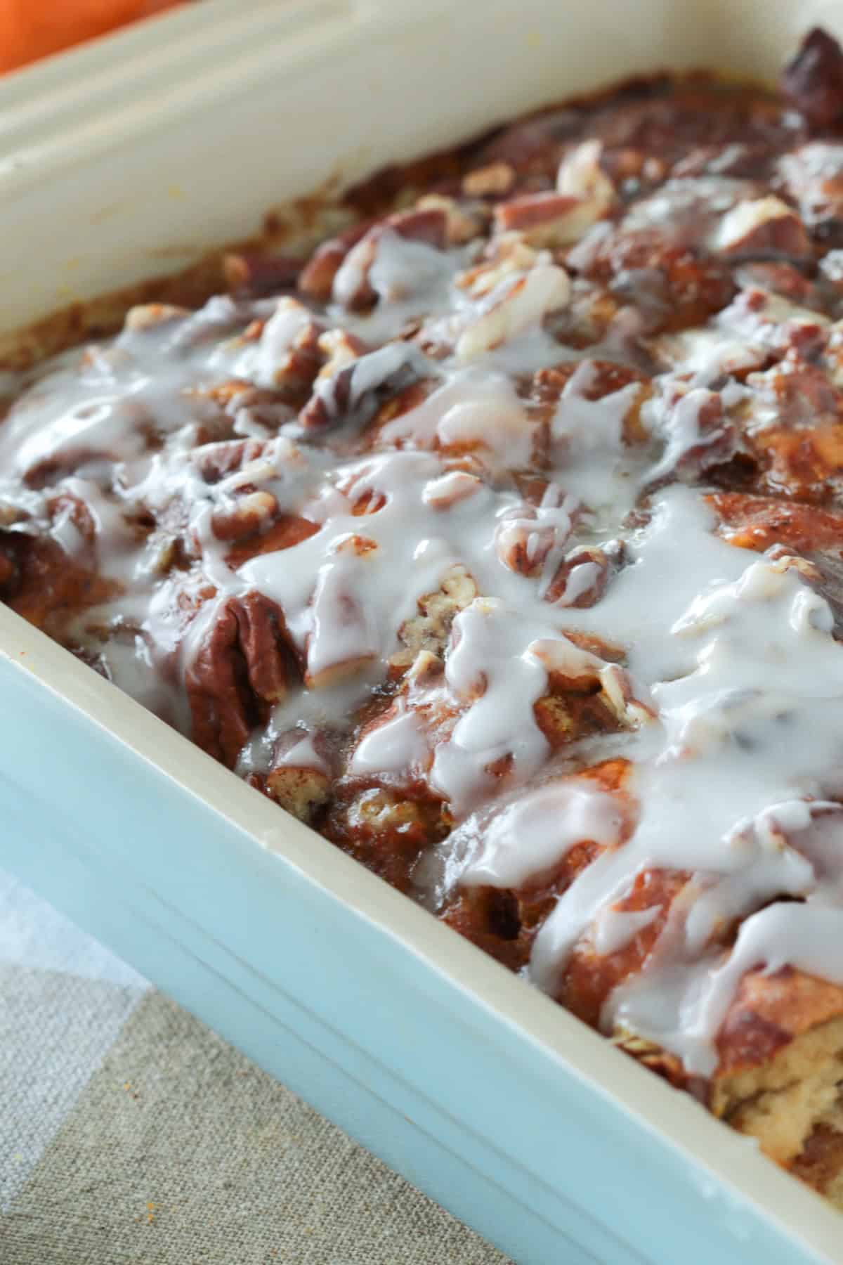 Casserole dish of pumpkin cinnamon roll french toast.