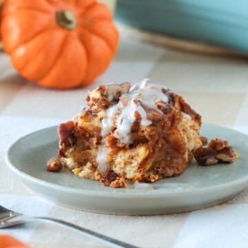 Pumpkin Cinnamon Roll French Toast Casserole sliced on a plate.