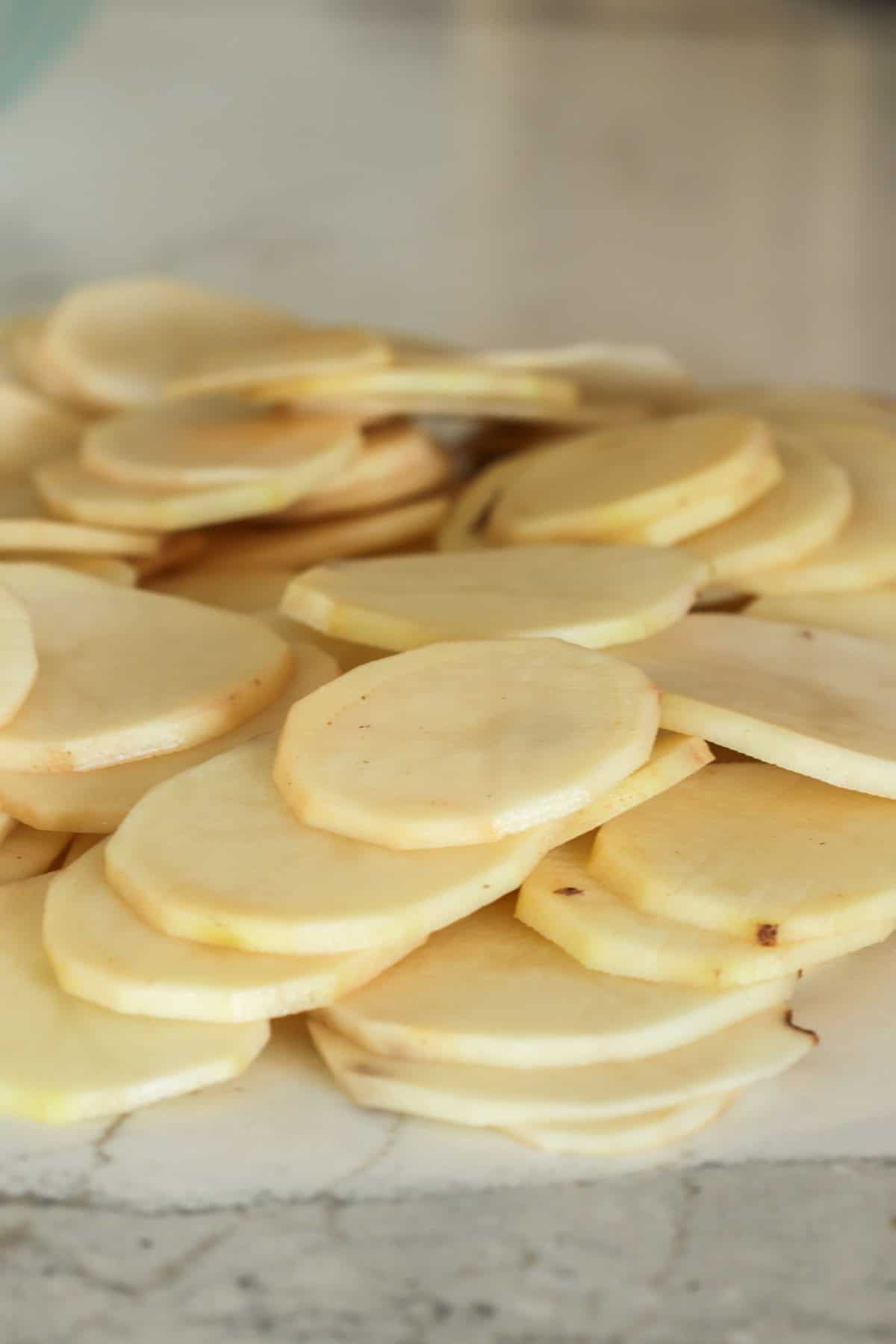 Sliced potatoes for scalloped potatoes.