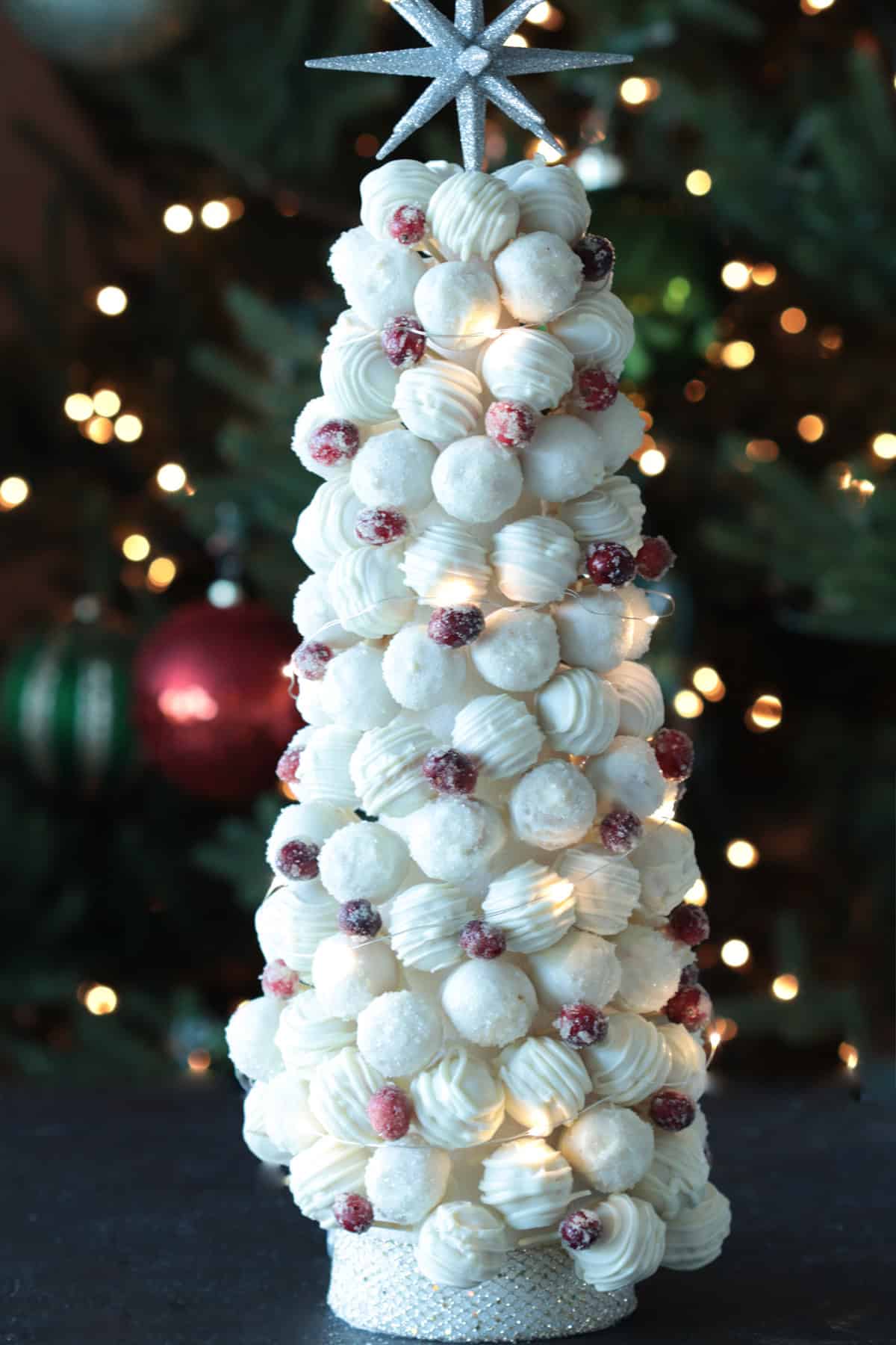 White cake ball tree with star on top.