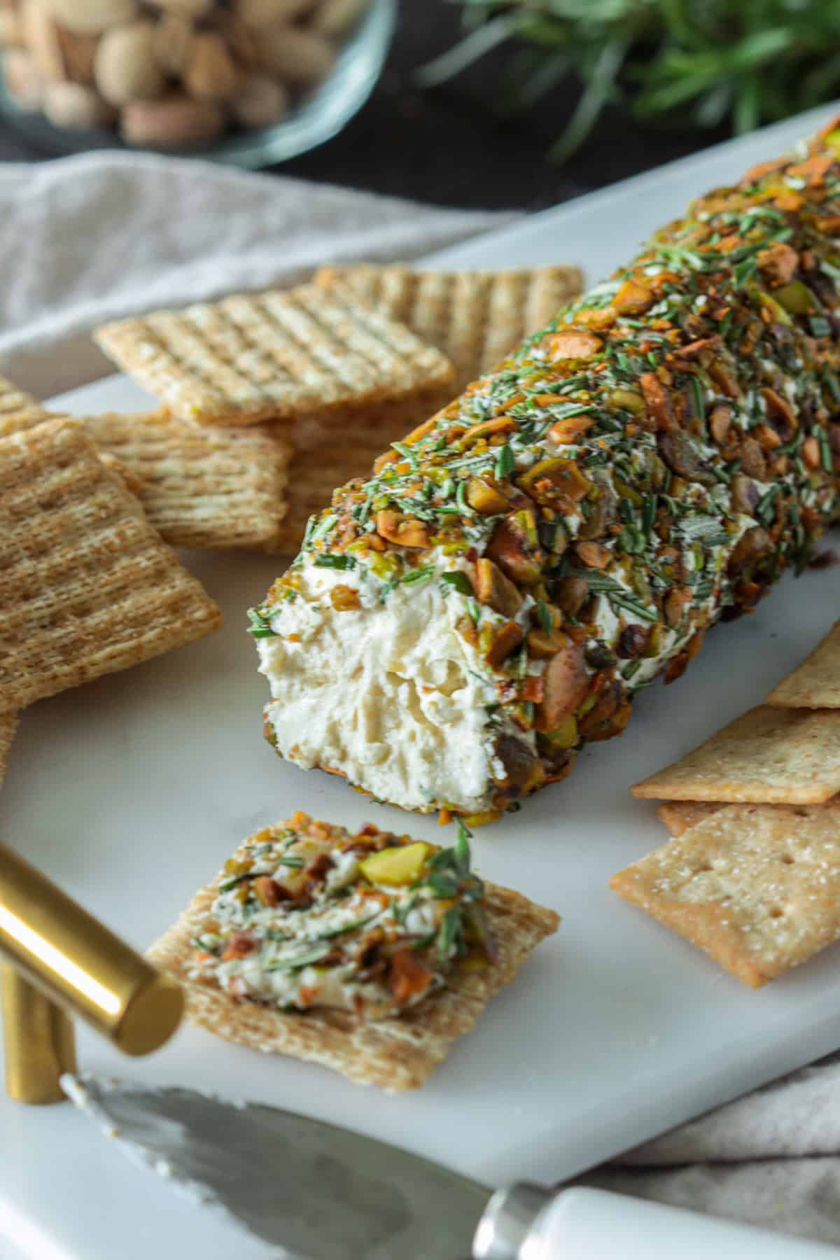 Goat cheese log with rosemary and pistachio crust.