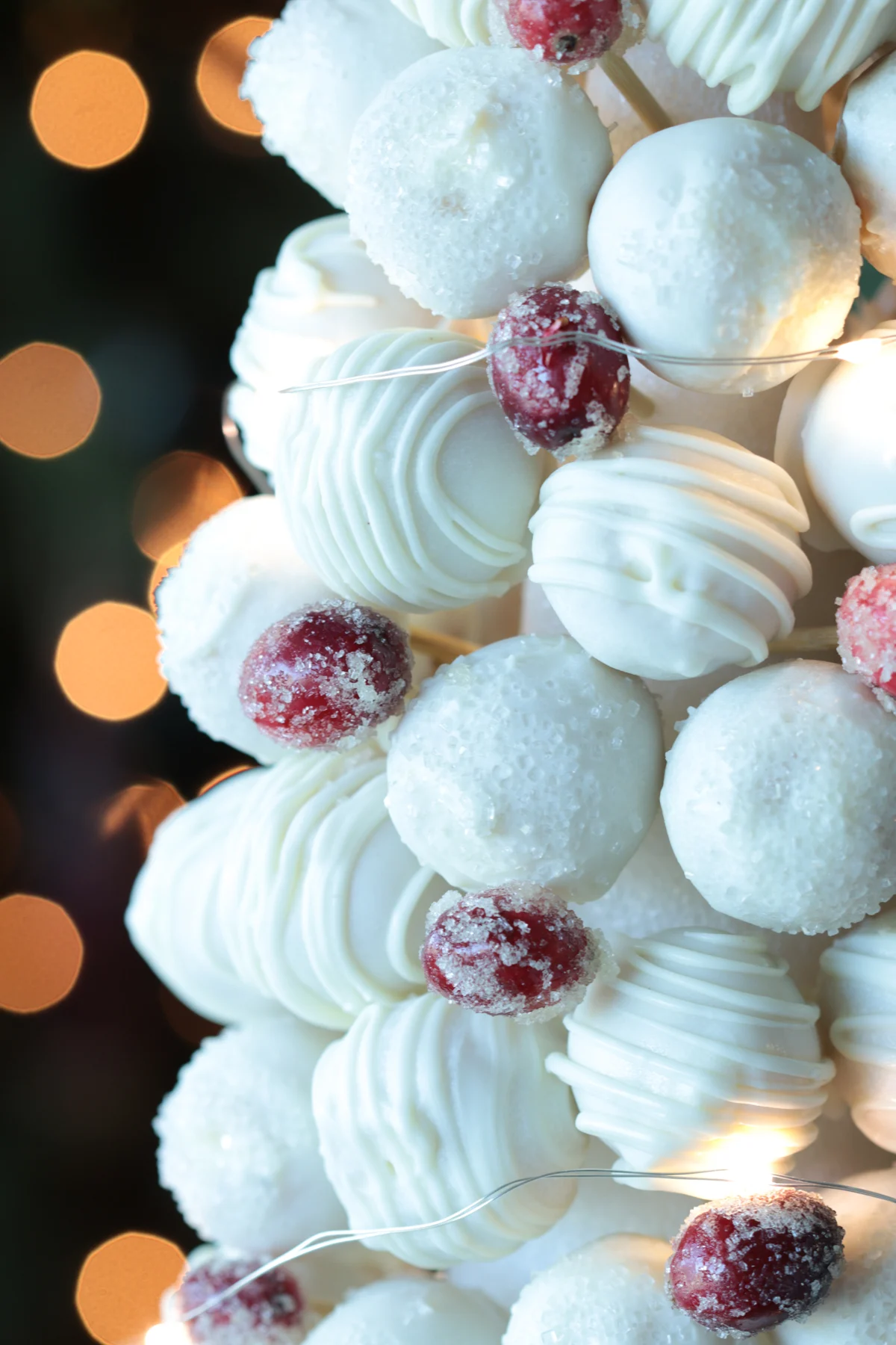 Christmas cake ball tree close up with cranberries.