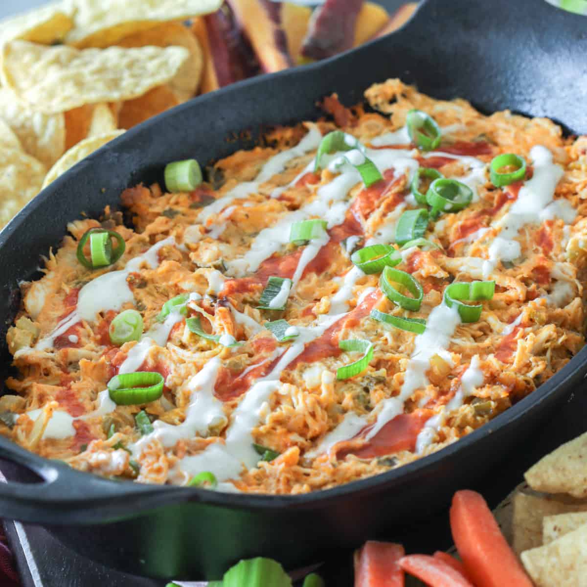 Buffalo chicken dip without dairy in a cast iron skillet.